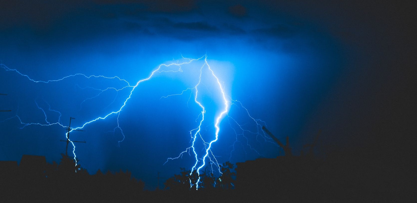 Image of lightning at night by Alex Dukhanov @ Unsplash